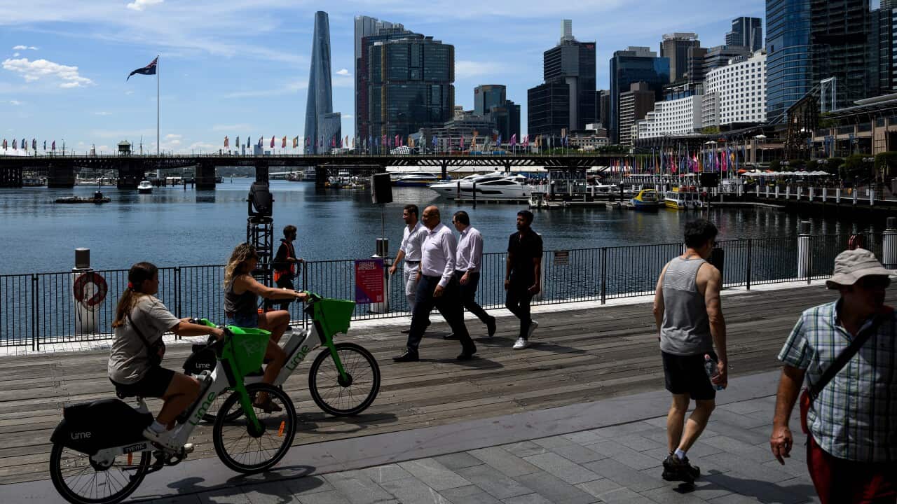 People riding bikes at Sydney's Darling Harbour