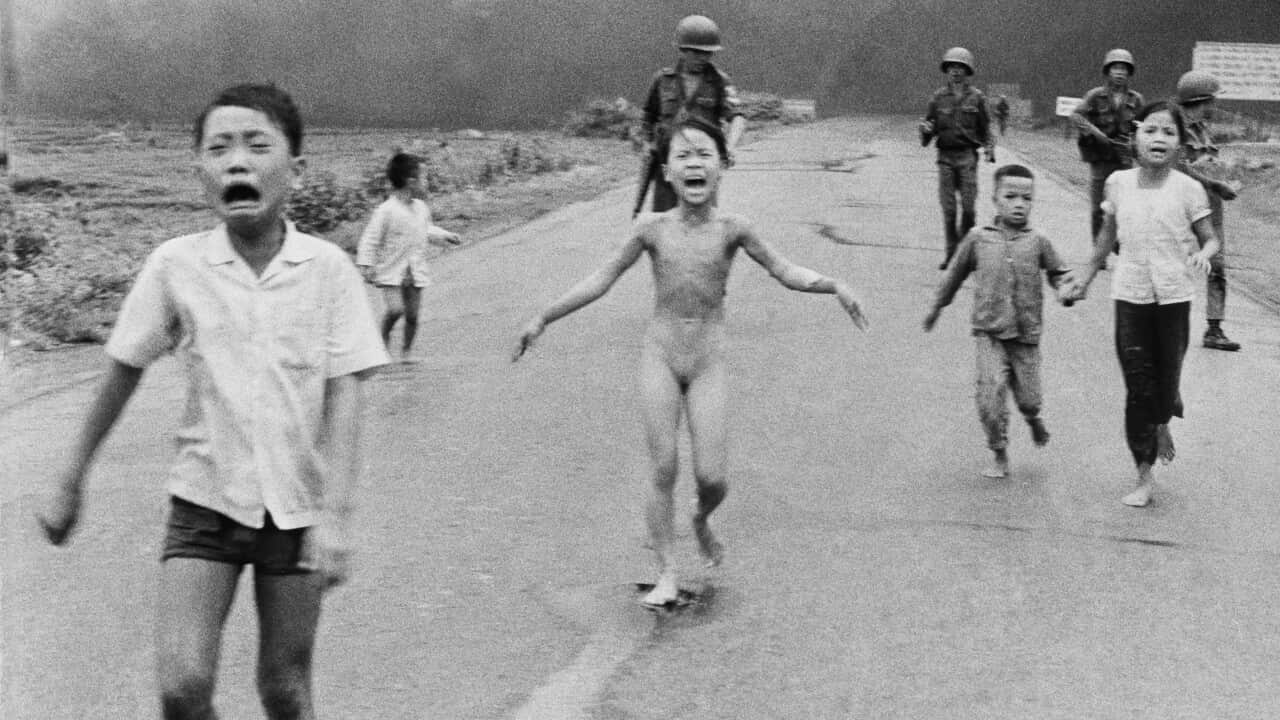 1972, file photo, 9-year-old Kim Phuc, center, runs followed by South Vietnamese forces, down Route 1 near Trang Bang after a South Vietnamese plane accidentally dropped its flaming napalm on its own troops and civilians. The terrified girl had ripped off