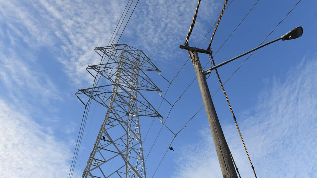 A high voltage transmission line and a power pole.