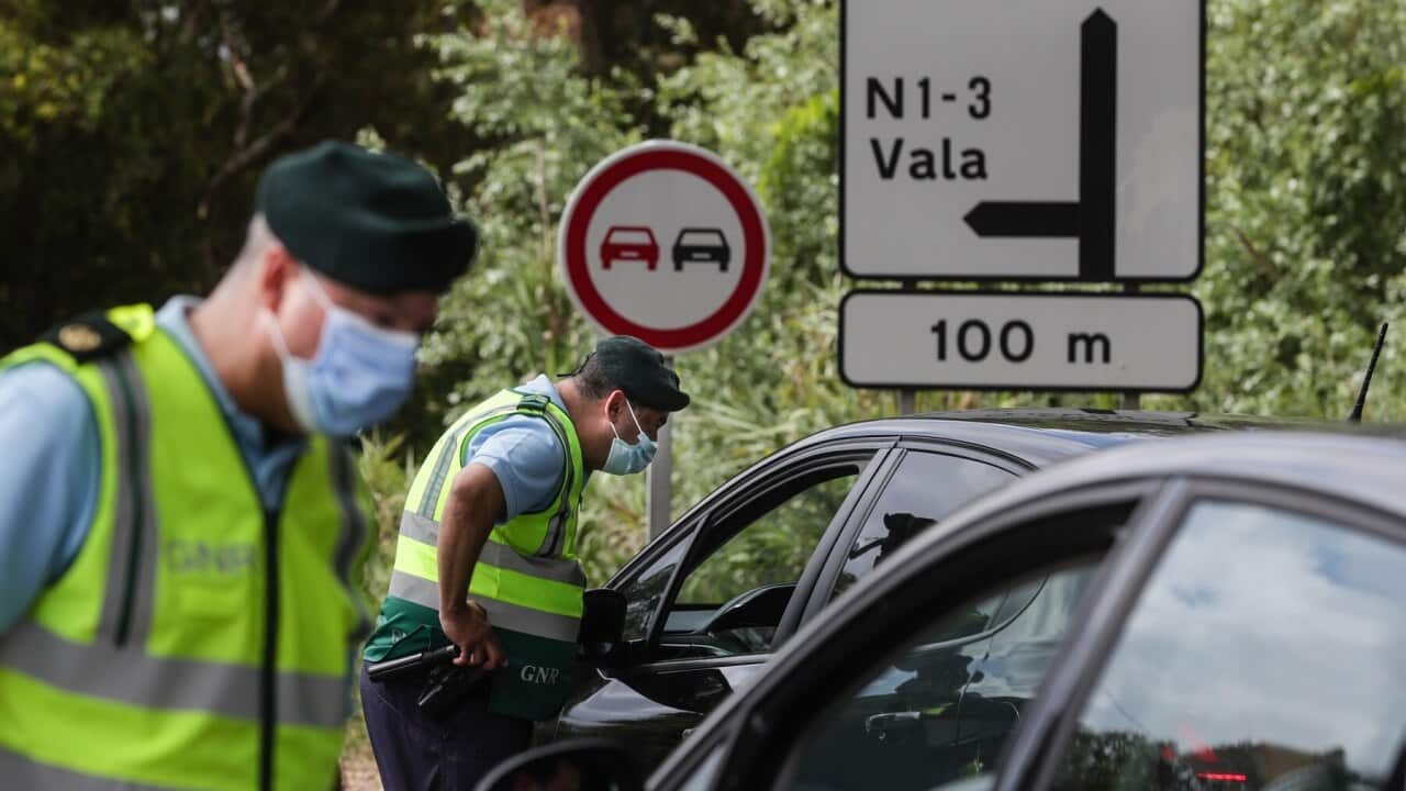 Police monitor traffic in and out of Lisbon, Portugal