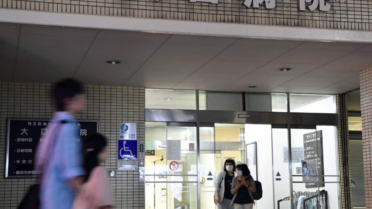 People outside the Oguchi Hospital in Yokohama