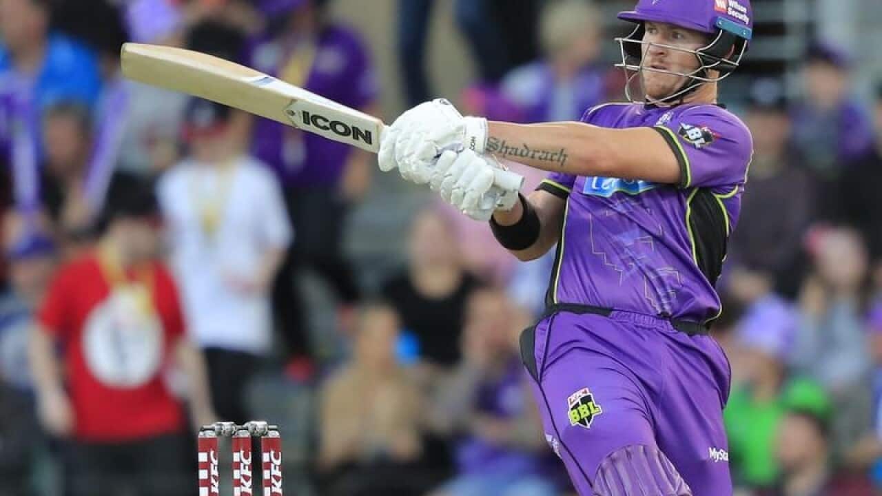 D'Arcy Short of the Hurricanes plays a shot.