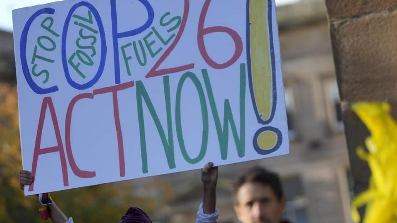 Activists participate in a climate change protest in Glasgow