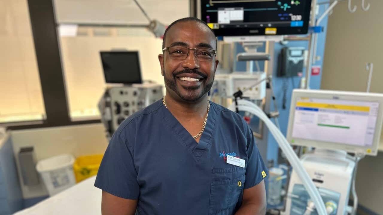 Fissaha Gobena at work in Melbourne (SBS) (2).jpg