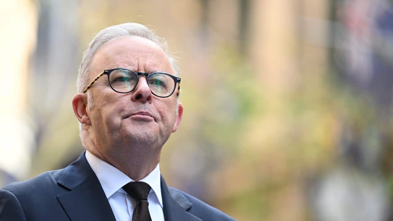 A man in a suit looking ahead