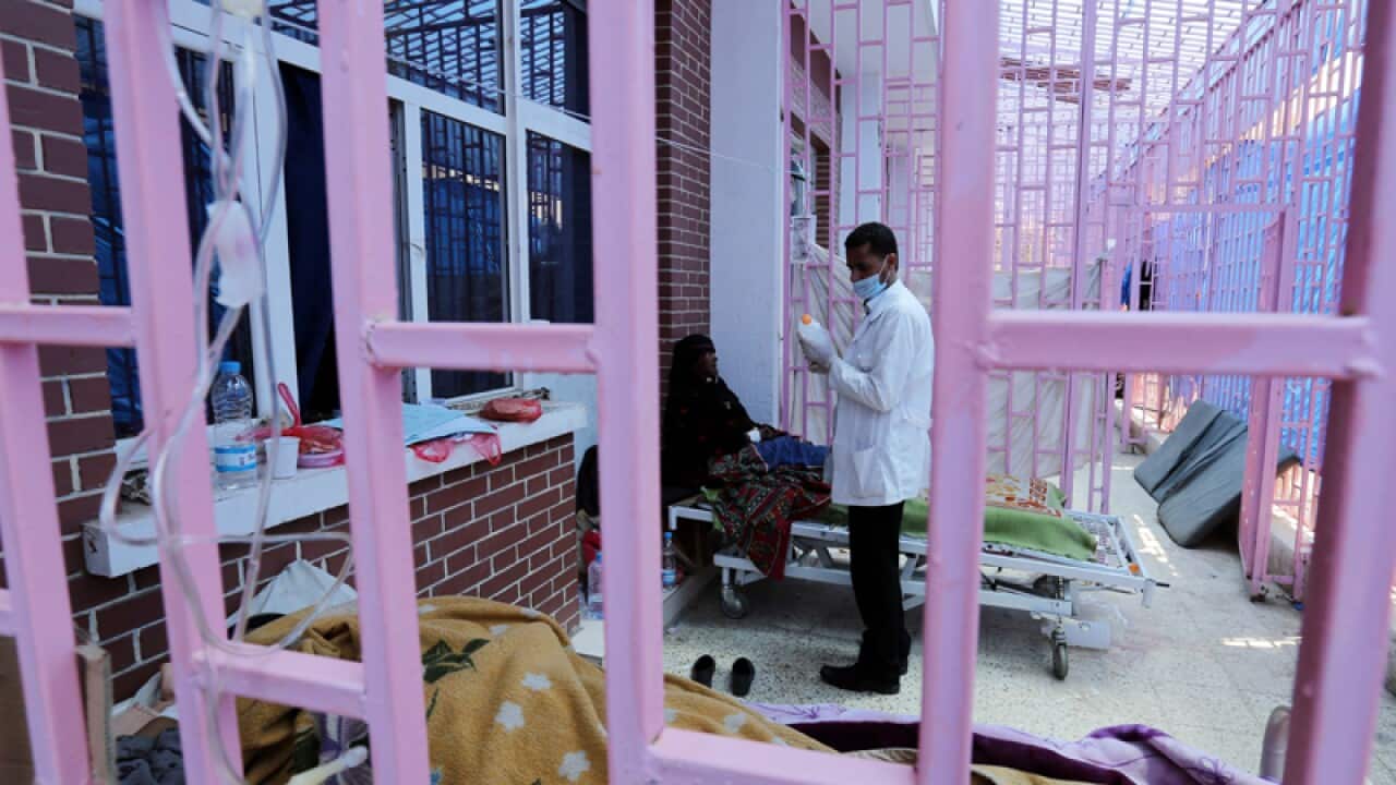 A Yemeni medic treats a cholera-infected woman at a hospital in Sana’a