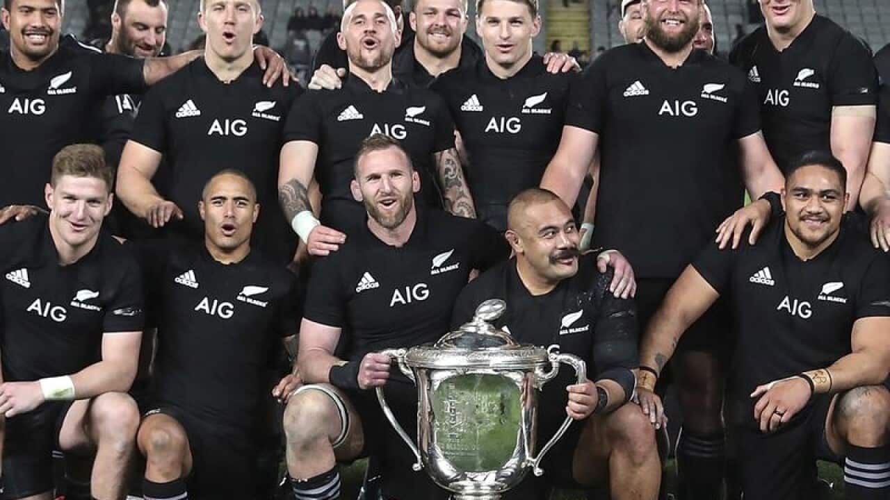 New Zealand All Blacks players with the Bledisloe Cup