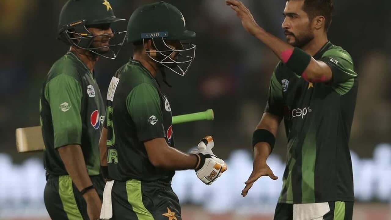 Mohammed Amir congratulates Babar Azam.