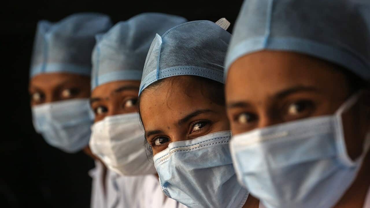 Health workers wait for their turn to receive a COVID-19 vaccine shot inside the vaccination centre at Shatabdi Hospital in Mumbai, India, 30 January 2021.
