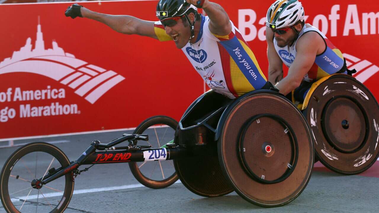 Australian Paralympian gold medallist Kurt Fearnley (R)