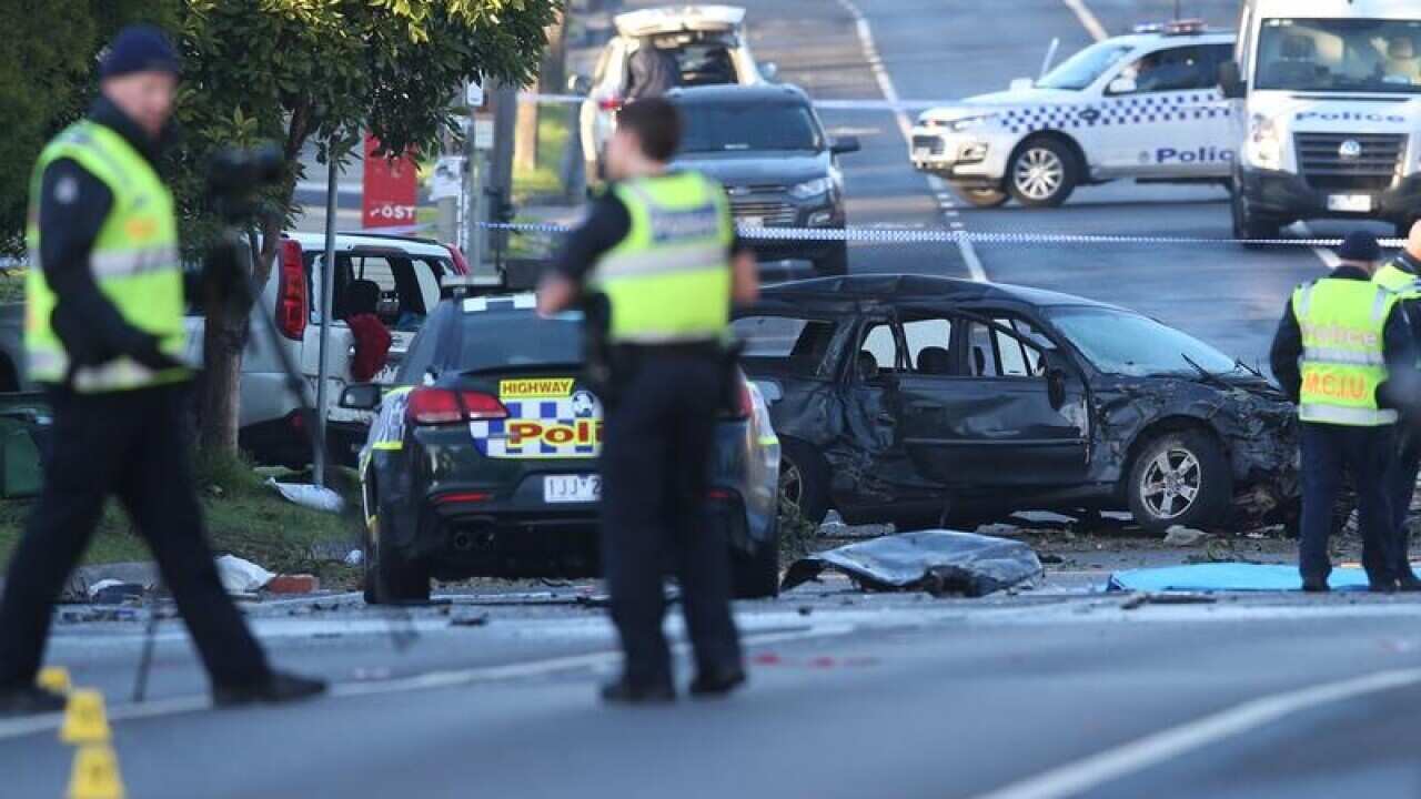Police detectives at the scene of a fatal crash in Northcote