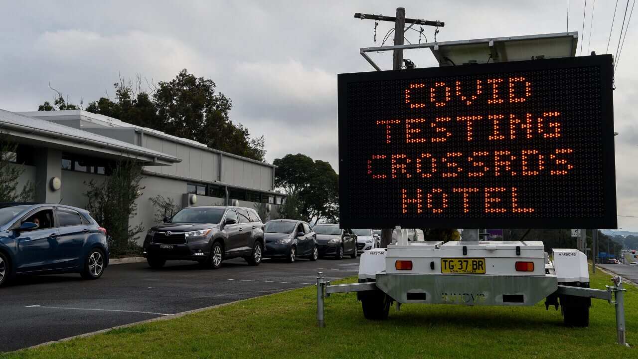 A COVID-19 testing alert sign at the Crossroads Hotel testing centre in Sydney.
