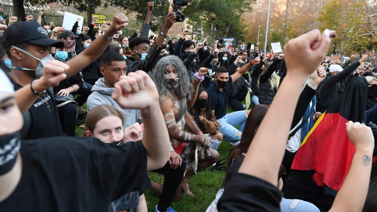 Protesters participate in a Black Lives Matter rally in Sydney, Saturday, June 6, 2020. A protest against the deaths of Aboriginal people in custody and solidarity with the US protests for George Floyd. (AAP Image/Dean Lewins) NO ARCHIVING