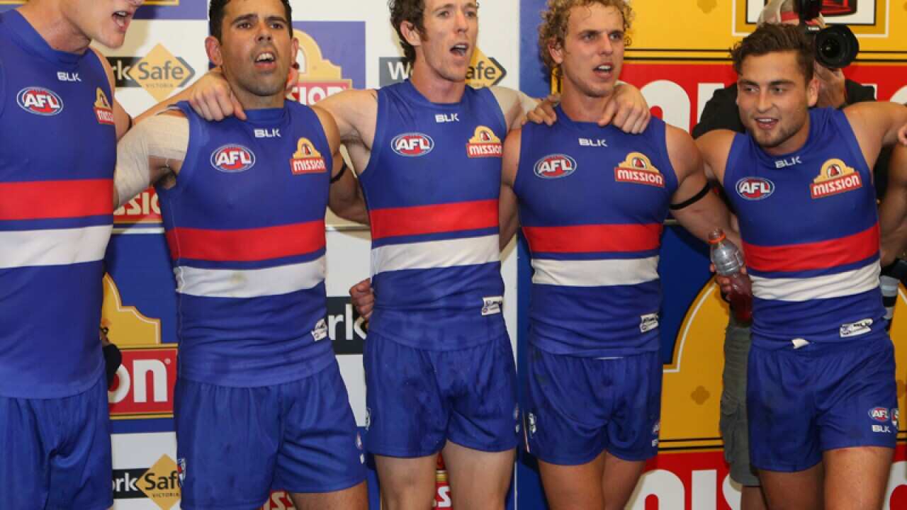 Western Bulldogs players celebrate at full time