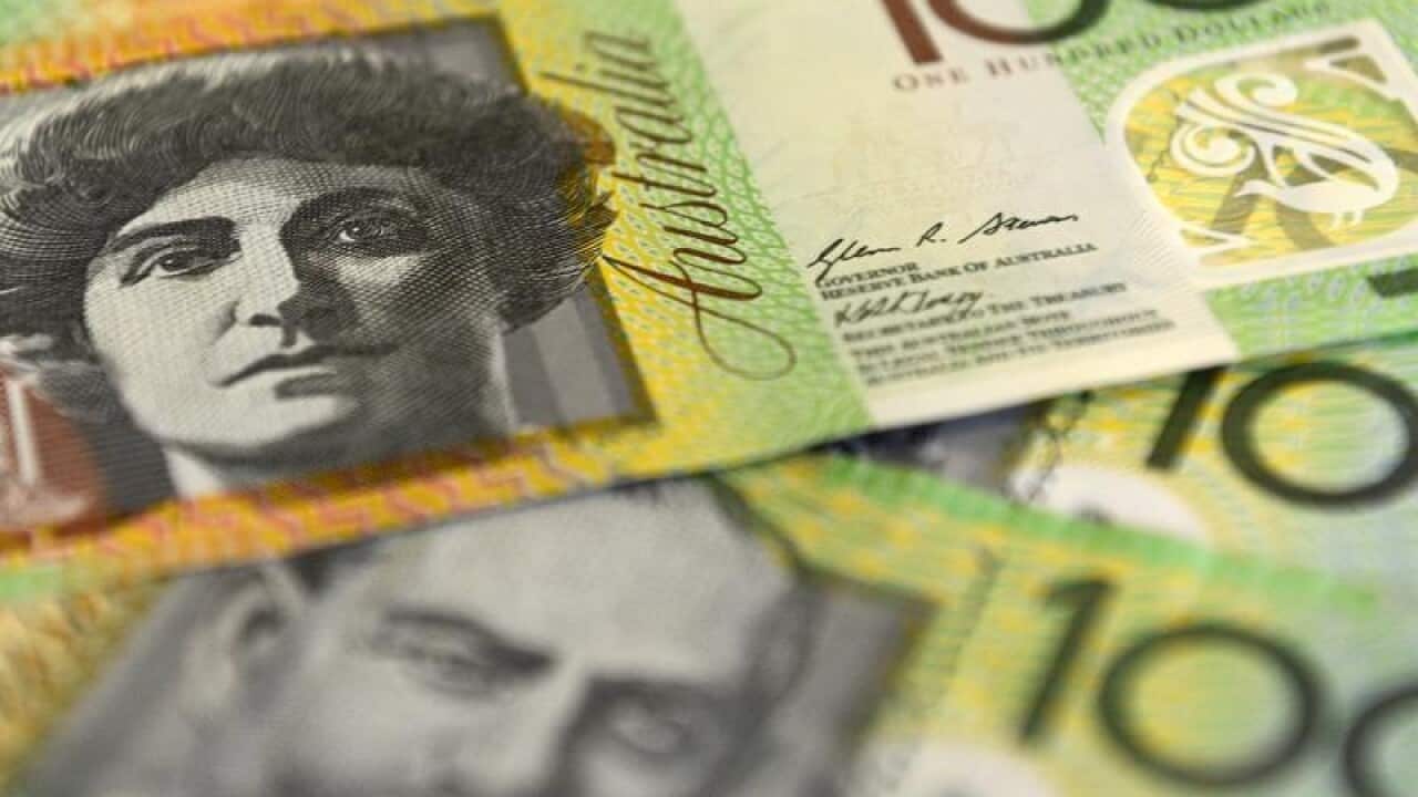 Australian $100 notes laid out.