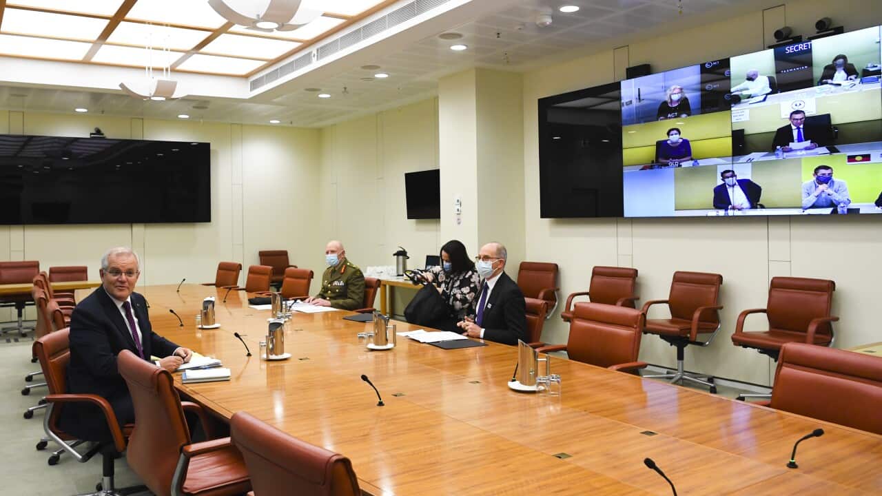 Prime Minister Scott Morrison, Australia’s Chief Medical Officer and COVID-19 Taskforce Commander attend a national cabinet meeting.