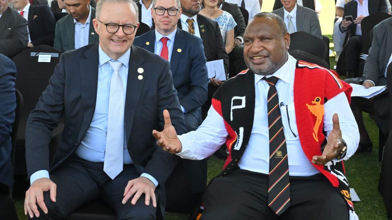 Prime Minister Anthony Albanese and Papua New Guinea’s Prime Minister James Marape seated next to each other.