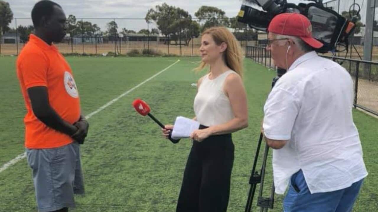 Nathanial Nhial Majur and the SBS News team