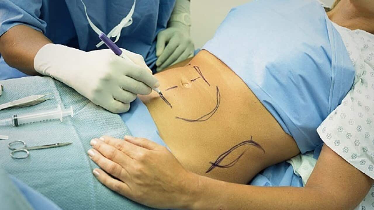 removing fat cells between the skin and underlying muscles