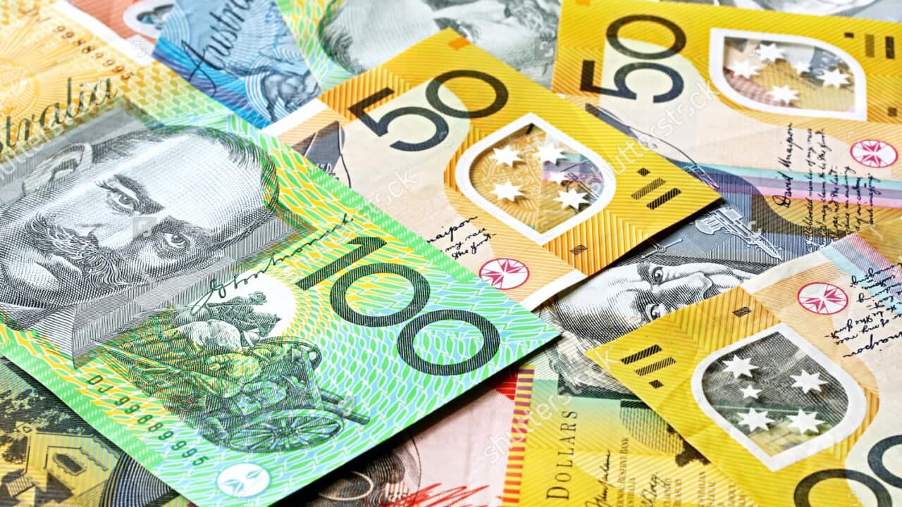 Australian banknotes laid out on a table.
