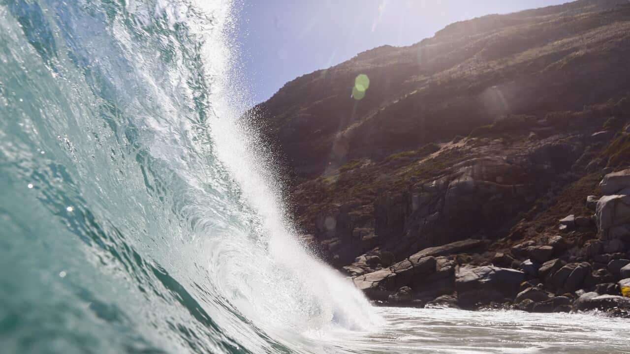 A wave breaks in the Atlantic Ocean