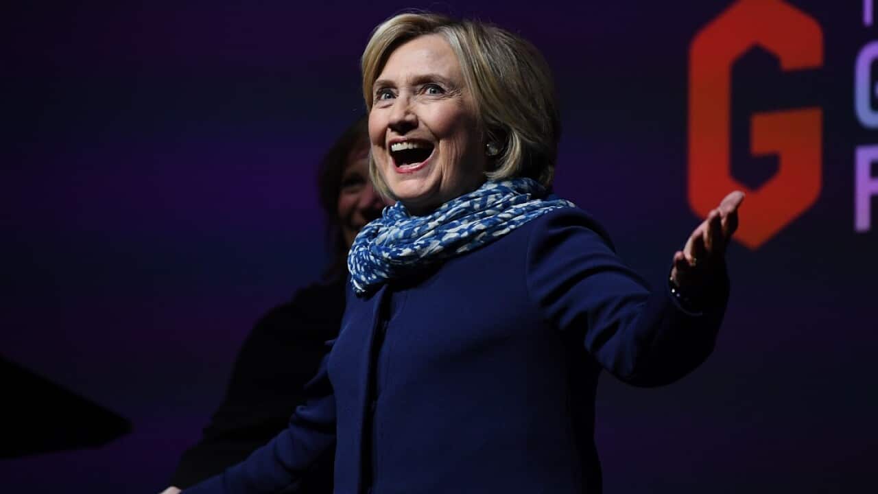 Former US secretary of state Hillary Clinton gestures to the crowd as she walks on stage during a Women World Changers Series event at the ICC Sydney Theatre in Sydney, Thursday, May 11, 2018.  (AAP Image/David Moir) NO ARCHIVING