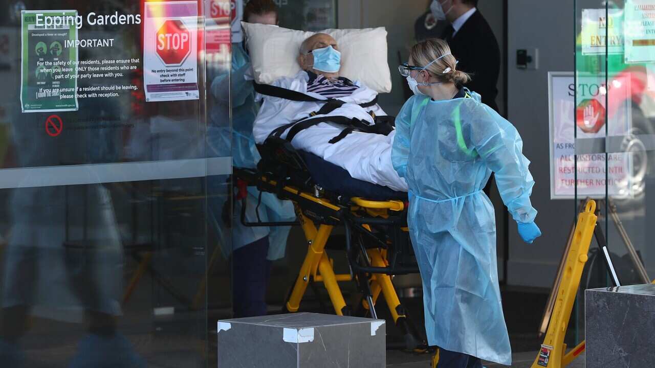 A resident is taken from the Epping Gardens Aged Care Home in Melbourne