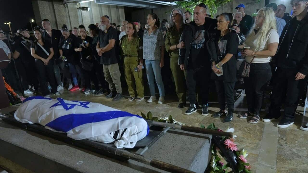 Relatives and friends attend the funeral of slain hostage Eitan Levi after his body was returned from Gaza as part of a ceasefire agreement between Israel and Hamas.jpg