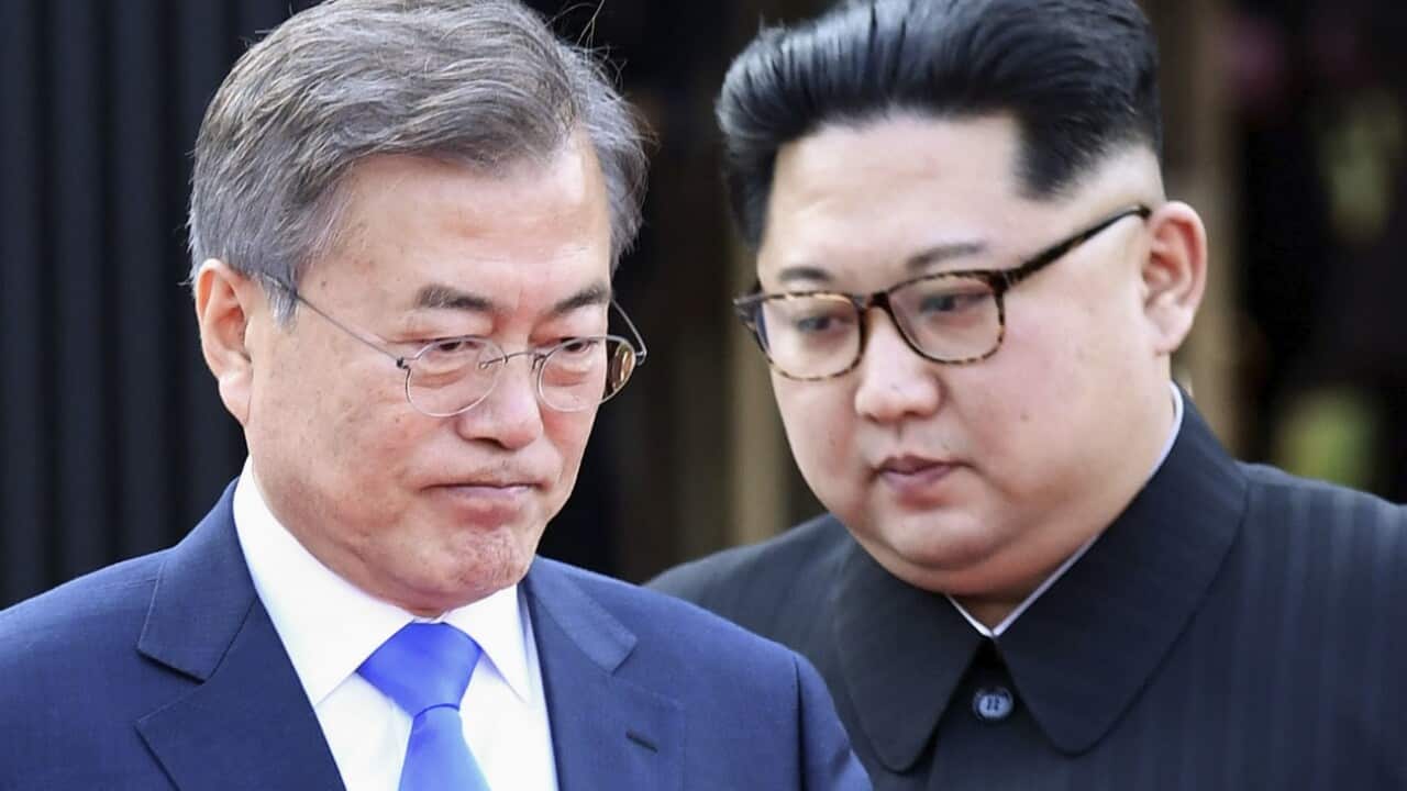 South Korean President Moon Jae In (L) and North Korean leader Kim Jong-un attend a ceremony after signing a joint statement