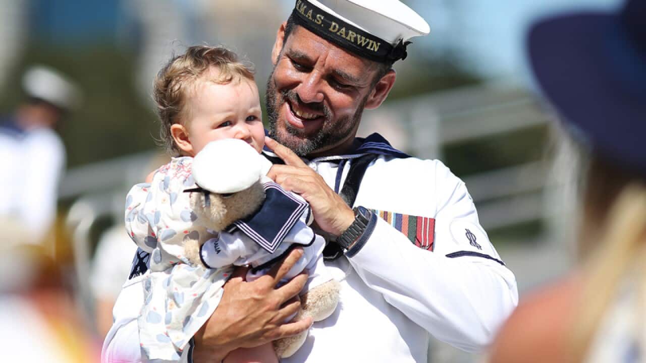 Able Seaman Boatswains Mate Glenn Richie with his daughter Ava
