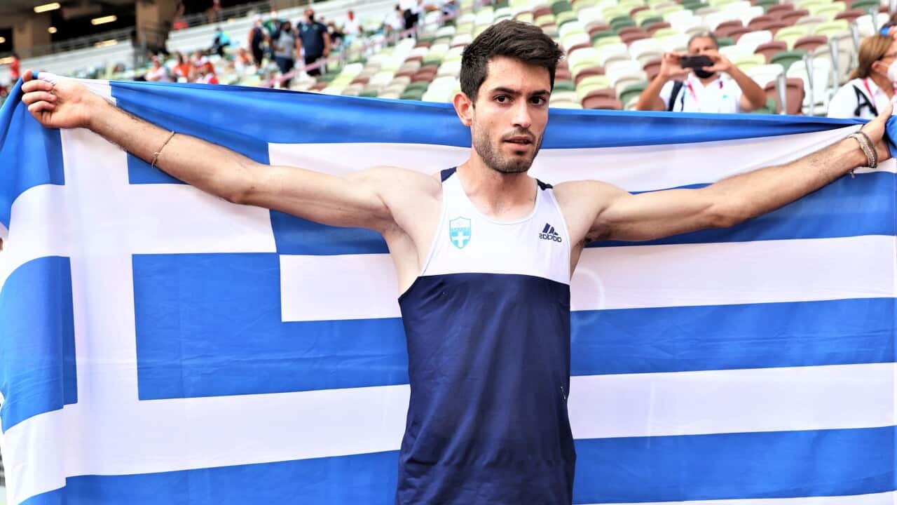 Gold Medalist Miltiadis Tentoglou with the Greek flag afer clinching the gold medal in the Men's Long Jump final in Tokyo 2020.