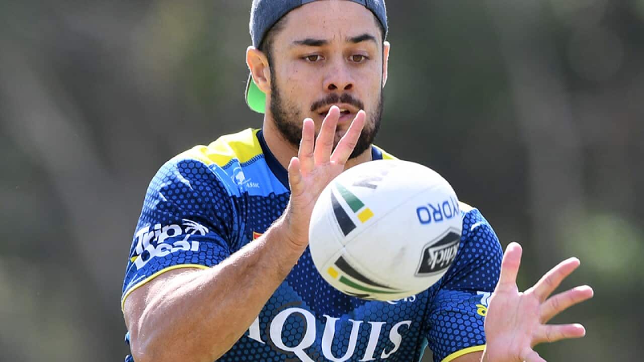 Jarryd Hayne receives the ball during a training session