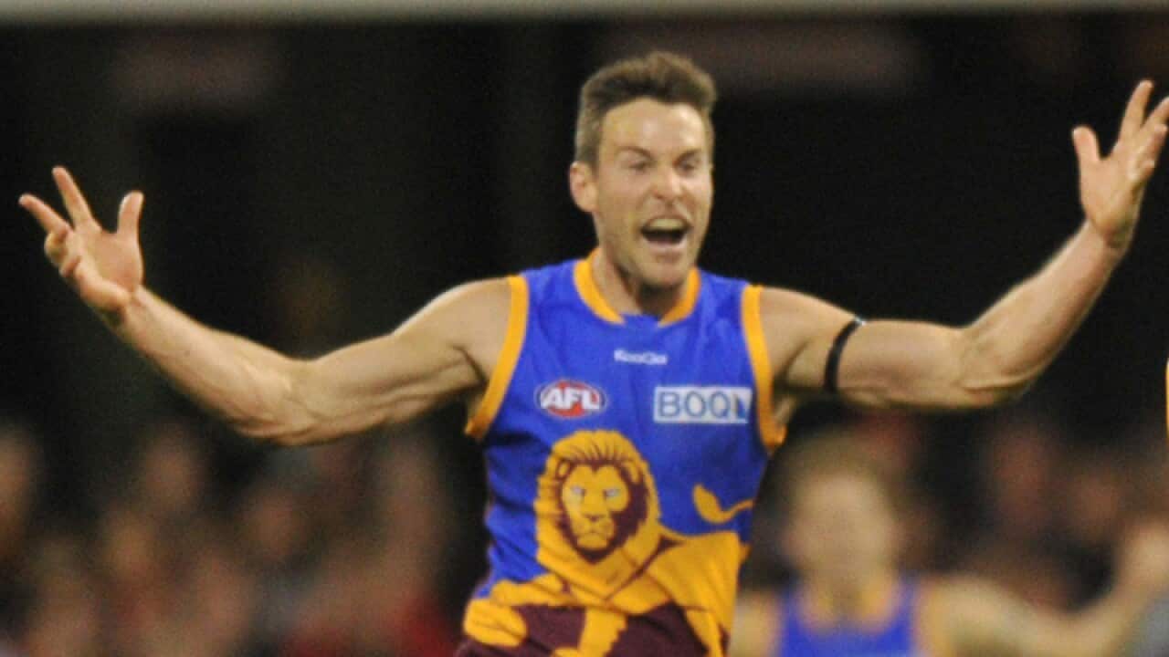 Brisbane's Andrew Raines (left)