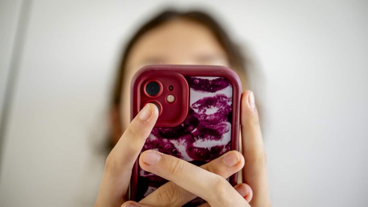 A teenage girl on her cell phone