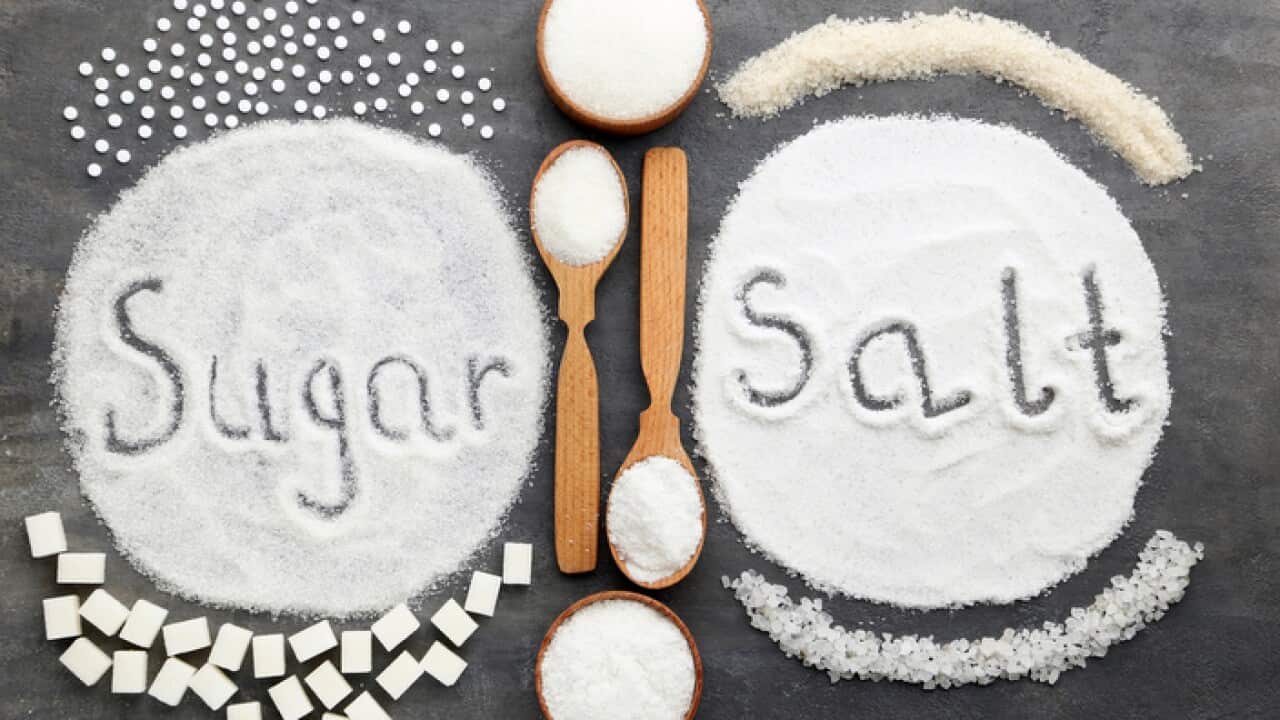 Inscription Sugar and Salt on grey wooden table