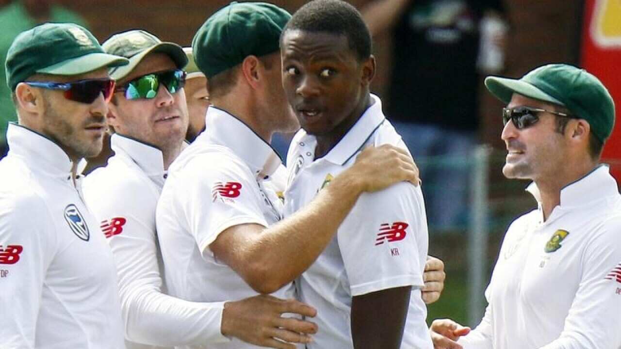 South Africa's bowler Kagiso Rabada celebrates with teammates.