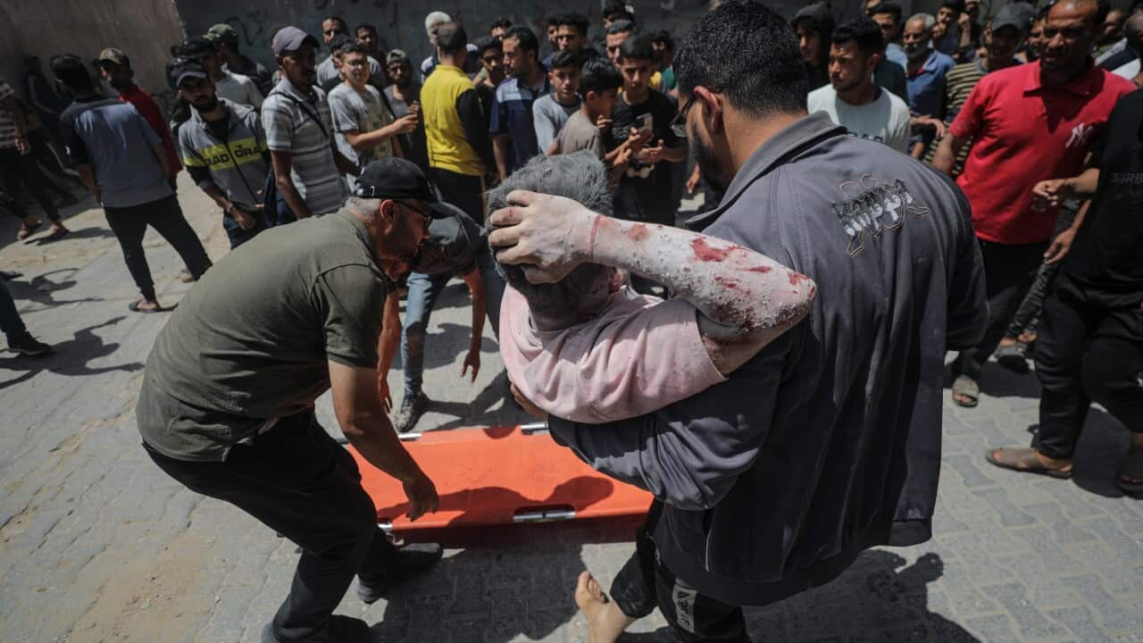 Palestinians search for survivors in Al Nuseirat after Israeli air strikes on Gaza