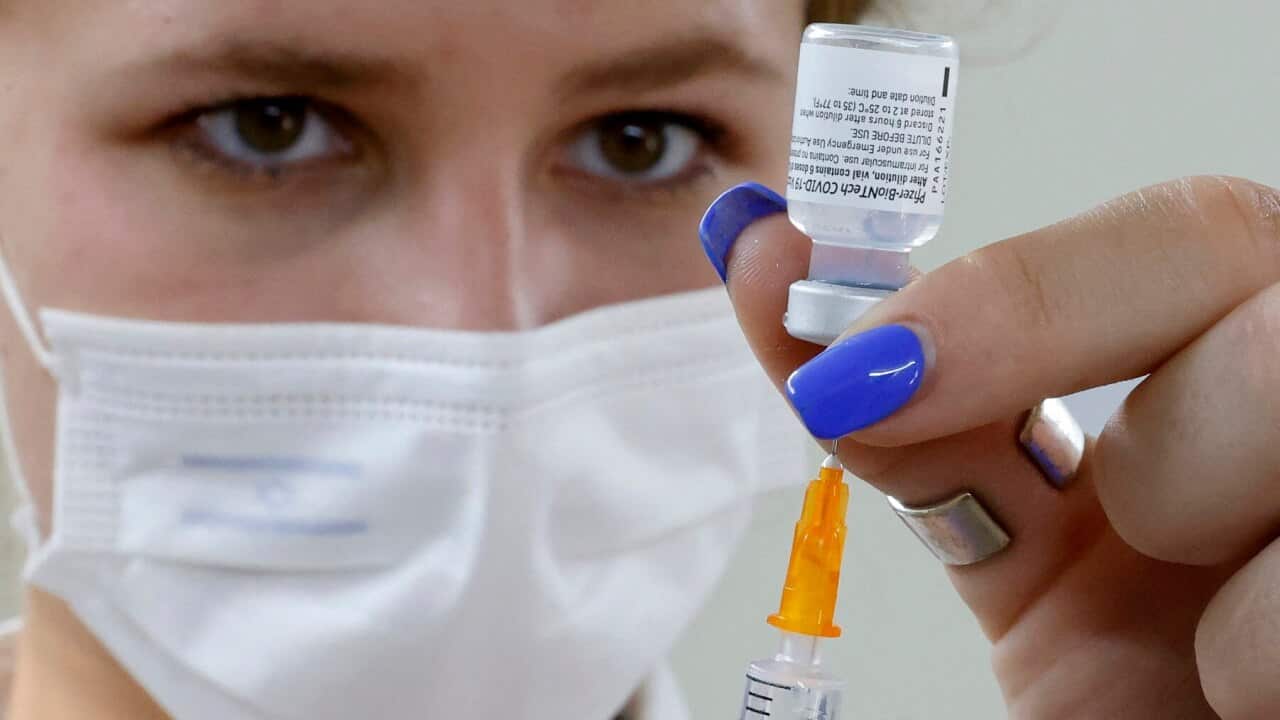 An Israeli medical worker prepares a dose of the PfizerBioNTech Covid-19 vaccine
