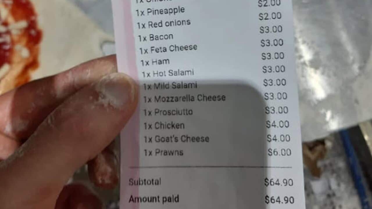 L'immagine dello scontrino della pizza, diventata virale sui gruppi social degli italiani d'Australia