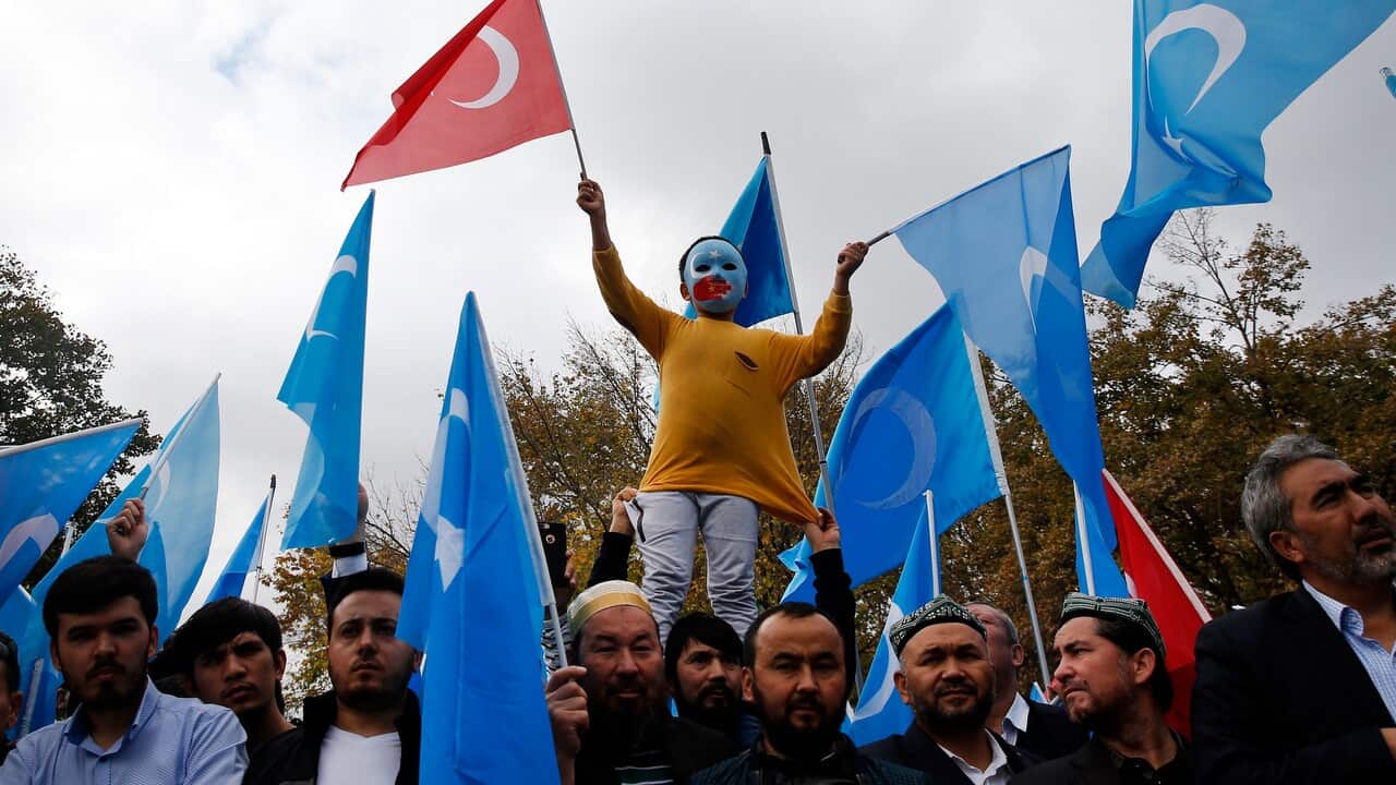 Members of the Uighur community living in Turkey participate in a protest in Istanbul.