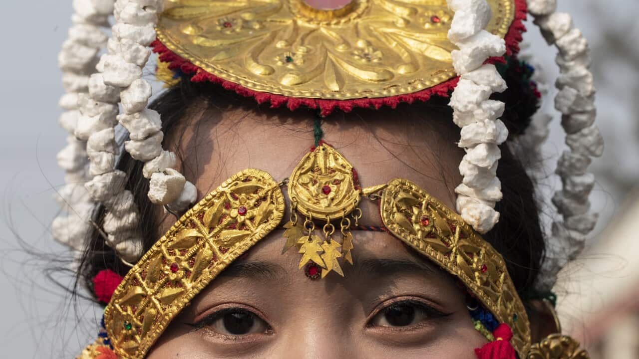 A woman dressed in Gurung traditional attire.