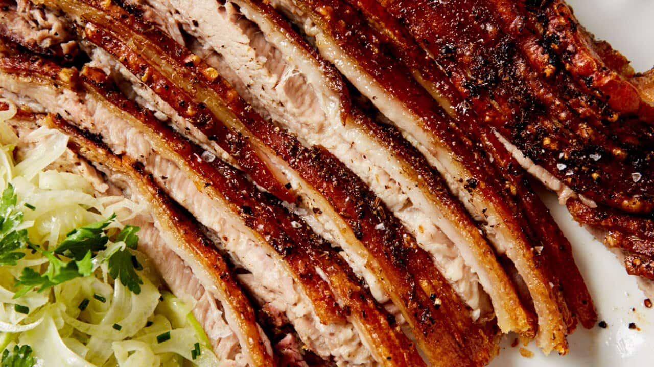 Roast pork belly with fennel and apple salad
