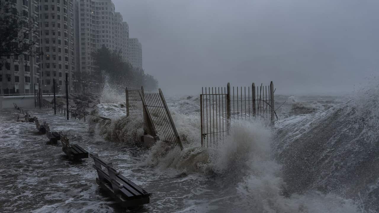 Strong waves crash against the waterfront in Hong Kong's Heng Fa Chuen area as Super Typhoon Ragasa approaches.