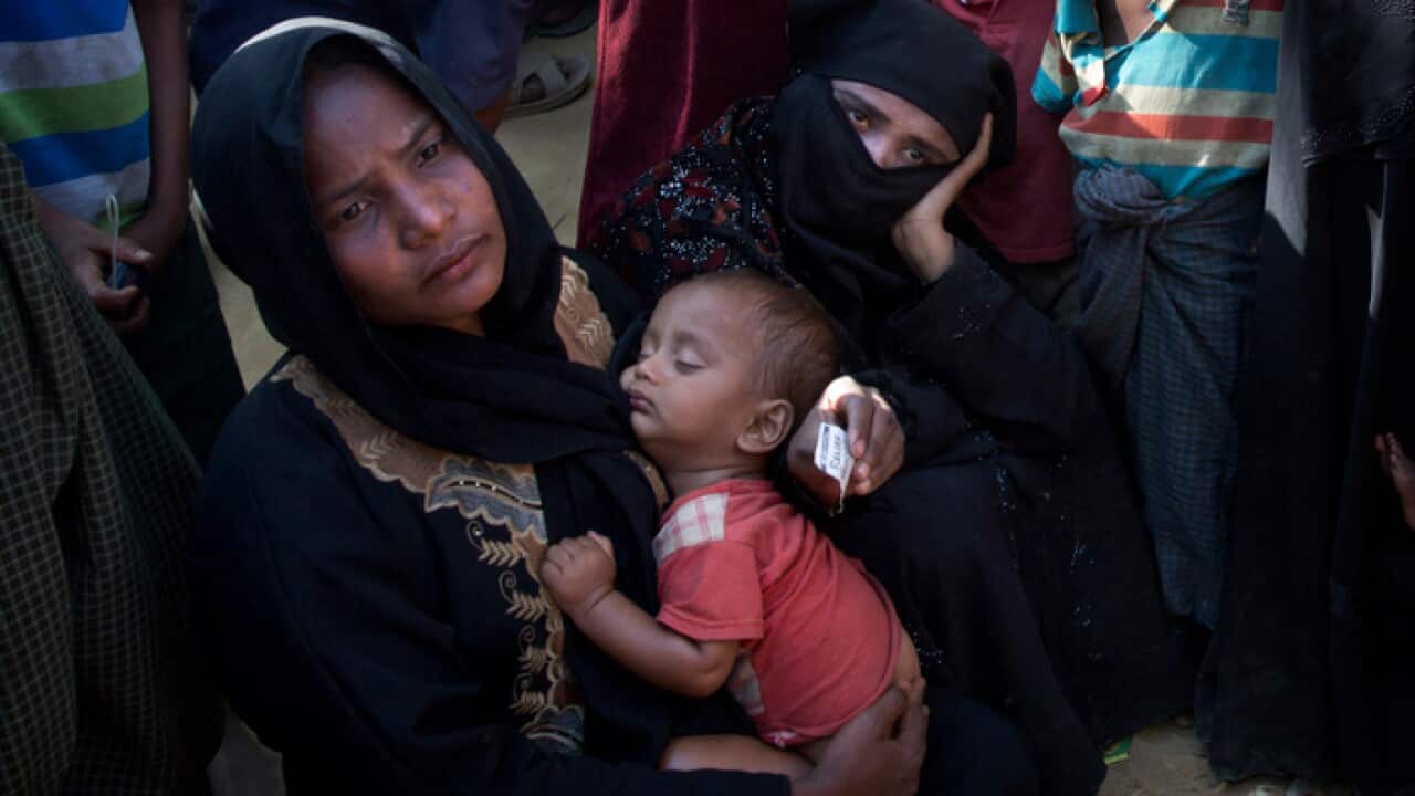 Rohingya women queue up outside a relief distribution centre at Kutupalong near Cox's Bazar, Bangladesh