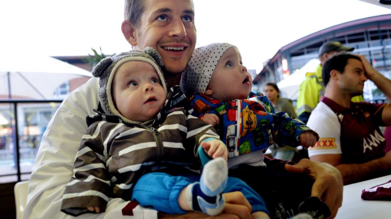 Titan's Ashley Harrison with his children