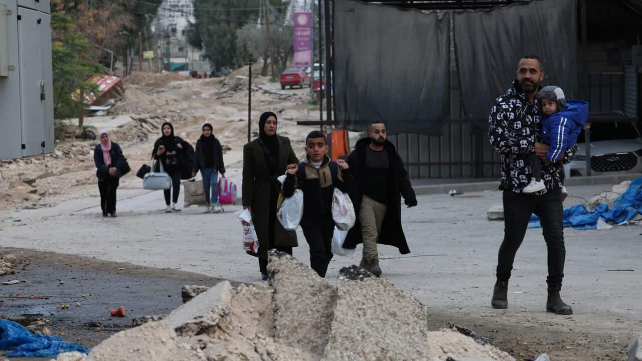 Palestinian families leave the Jenin camp on the second day of an Israeli military operation in the West Bank