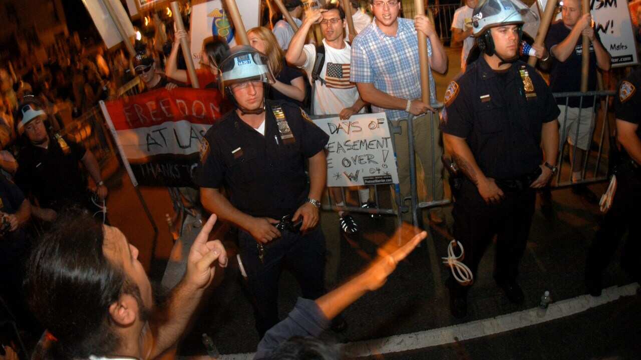 Pro and anti-Bush protesters argue outside the 2004 convention - Getty-1.jpg