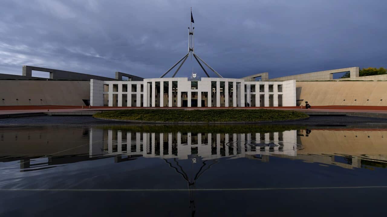 Parliament house in Canberra on an overcast day.