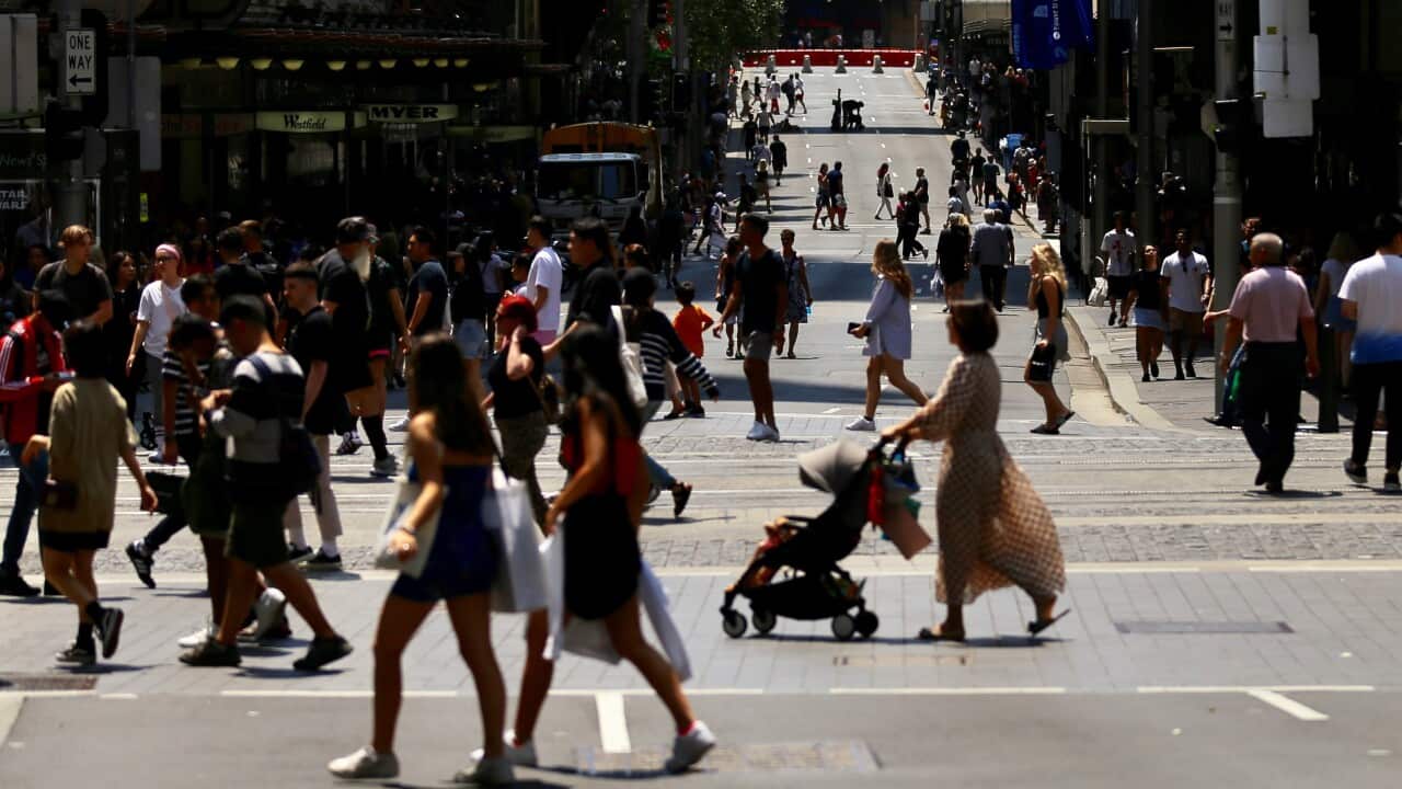 Shoppers walk the streets during the Boxing Day sales in the Sydney CBD, Thursday, December 26