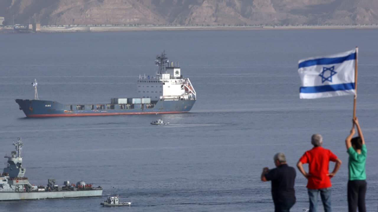 The Klos-C cargo vessel (B) approaches the port of Eilat